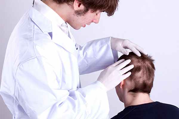 Атерома волосистой части головы